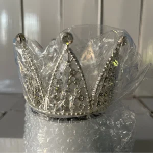 A tiara is sitting in the middle of a bubble wrap.