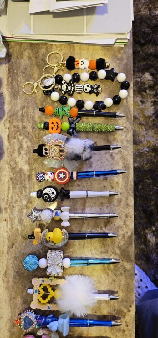 A table with many different pens and pencils