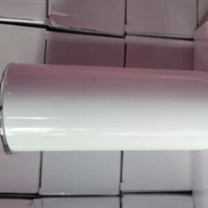 A white tube hanging from the ceiling of a bathroom.