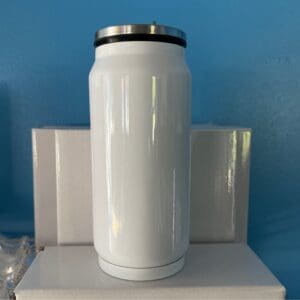 A white thermos sitting on top of a table.